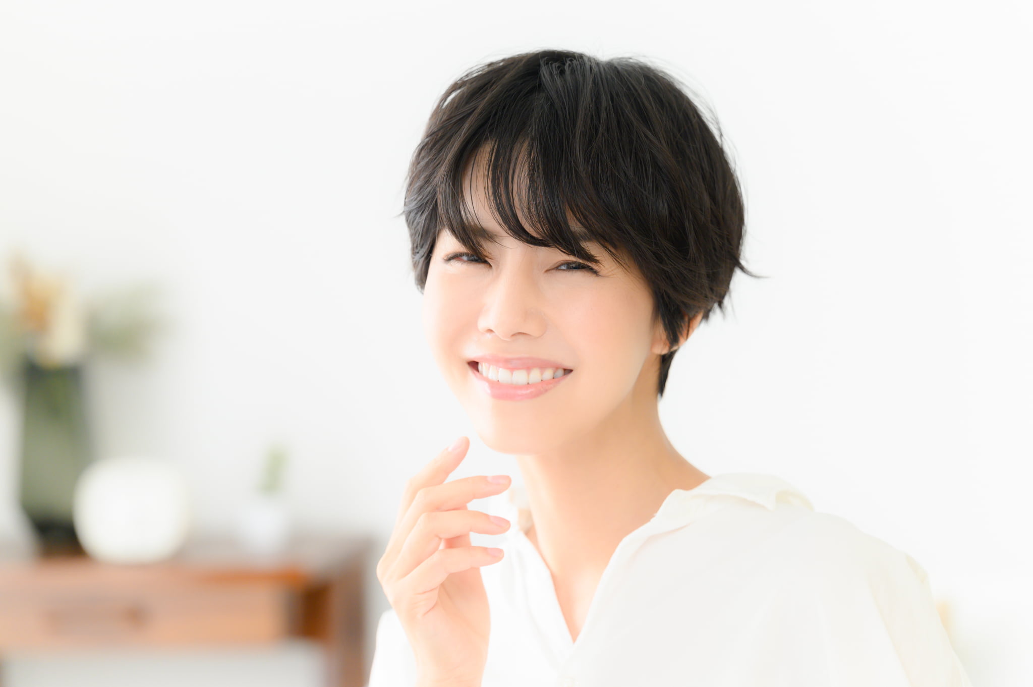 親知らずの虫歯を治療し笑顔で過ごす女性