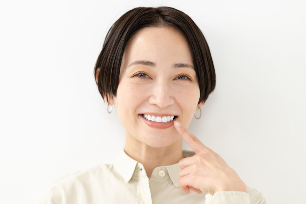 禁煙により歯周病の恐れがなくなった女性